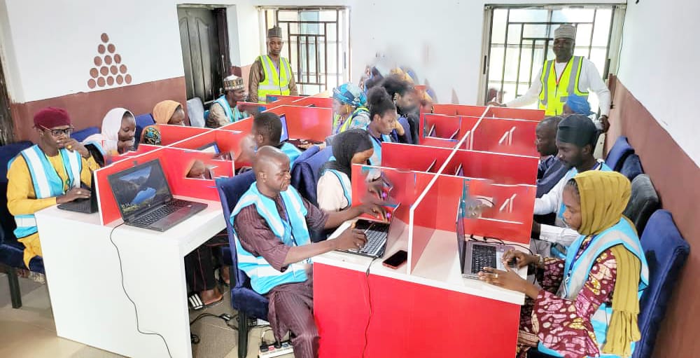 Trainees at individual computer workstations during ICT training